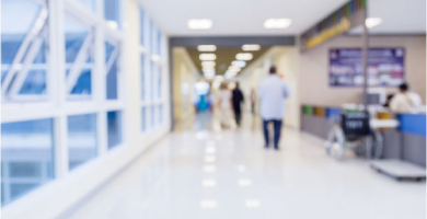 Hospital hallway with doctors, nurses, and patients